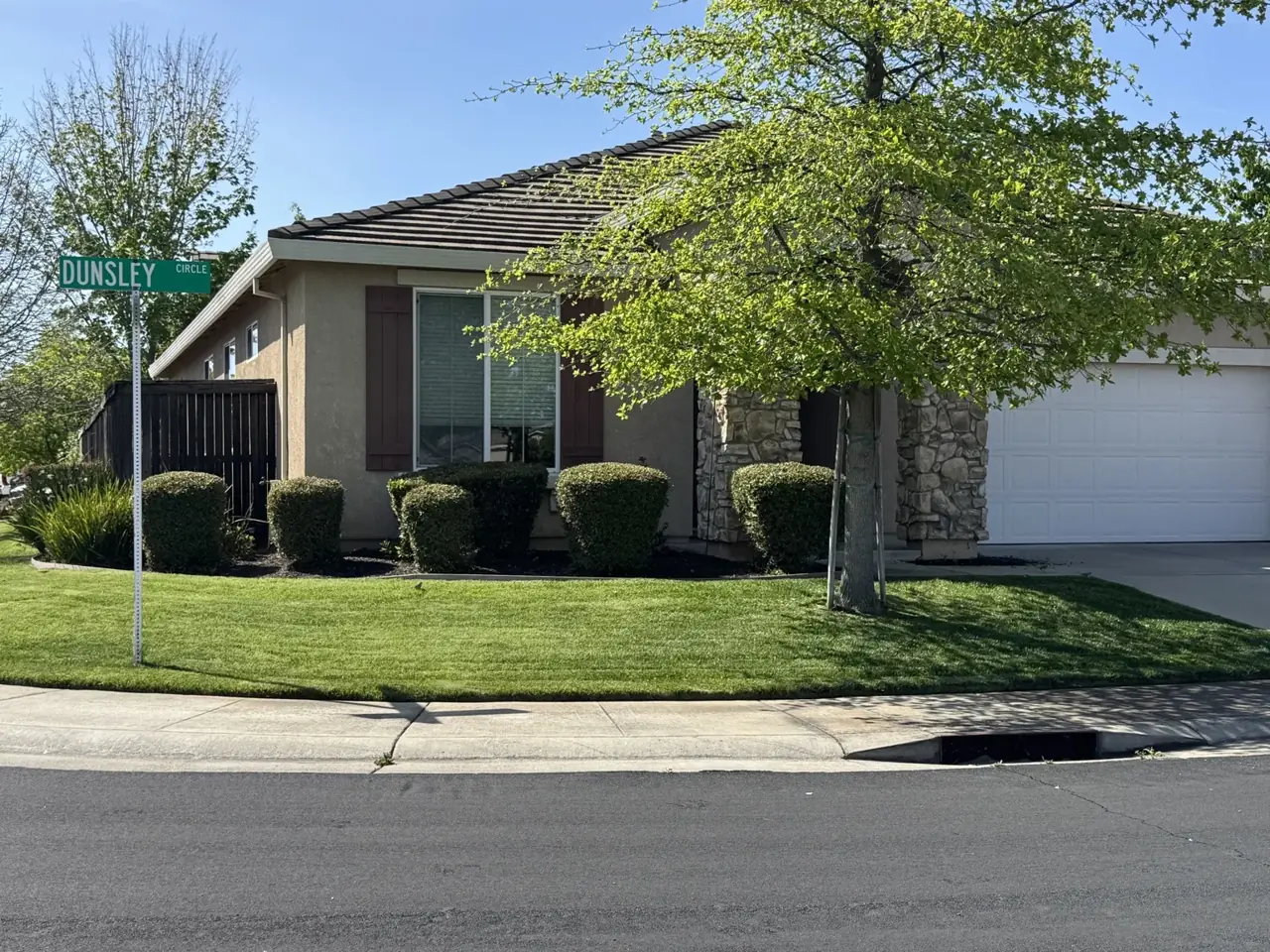 A maintained lawn and planted garden from the Perez Lawn Service Pro portfolio